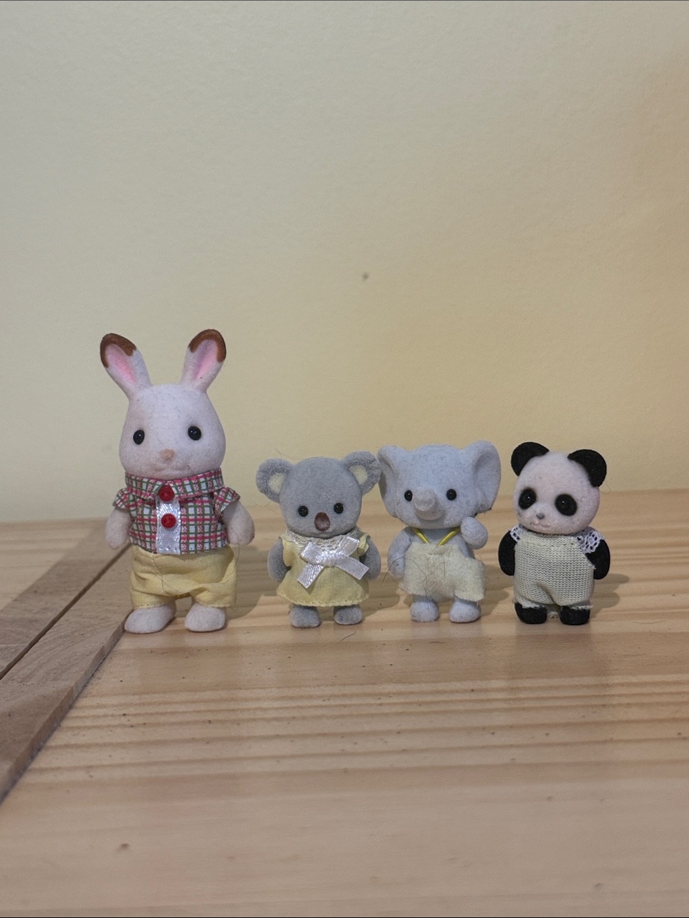 Daddy bunny and three baby calico critters